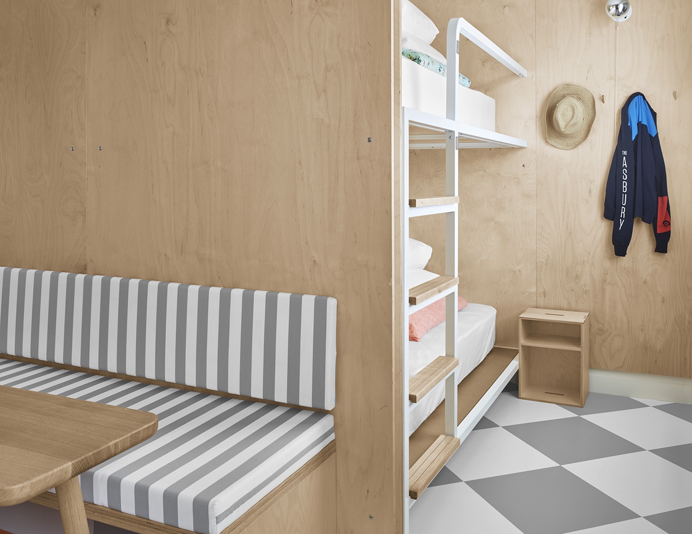 room with bunkbeds and sitting area