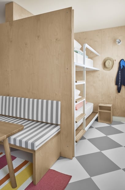 room with bunkbeds and sitting area