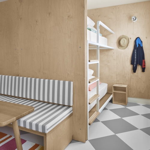 room with bunkbeds and sitting area