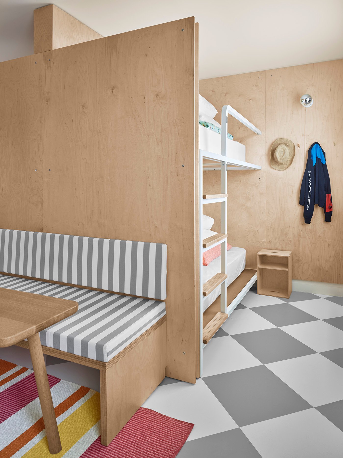 room with bunkbeds and sitting area