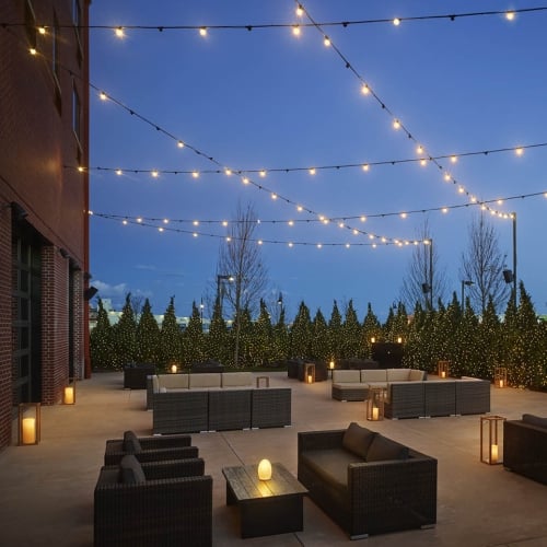 Outdoor terrance at night with couches