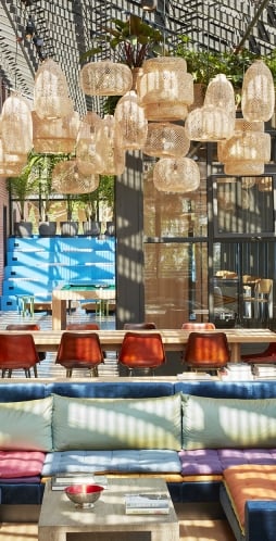 Eclectic lobby lounge at The Asbury, perfect for socializing or creative work amidst vibrant design. Asbury Park.