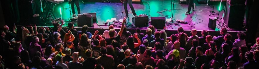 Vibrant live music performance with an enthusiastic crowd at The Asbury, capturing Asbury Park's rock 'n' roll soul.